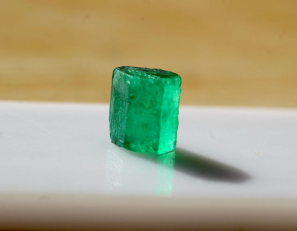 Submitted front photograph of green prismatic rough crystal
